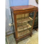 An Edwardian bow fronted china cabinet