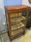 An Edwardian bow fronted china cabinet
