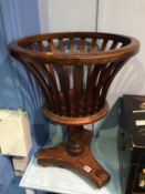 A reproduction mahogany plant stand