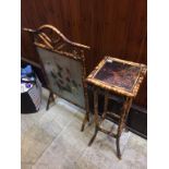 A bamboo fire screen and a pedestal table