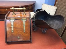 A wooden coal scuttle and a copper scuttle