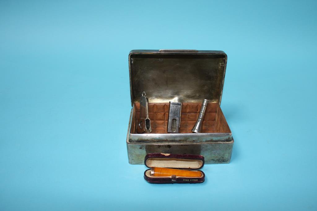 A silver cigarette box, cigar cutters etc.