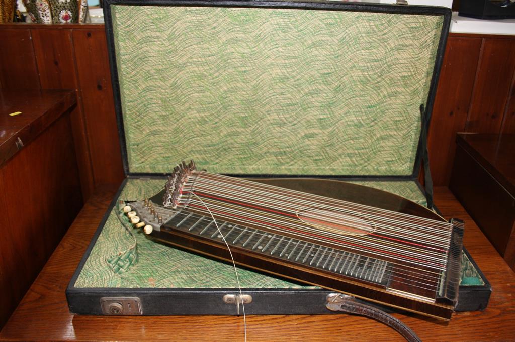 An Emanuel Kraus rosewood table harp