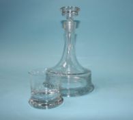 A clear glass decanter and six tumblers