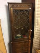 An oak corner cabinet