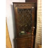 An oak corner cabinet