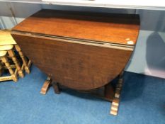 An oak gateleg table