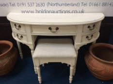 A cream side table and stool