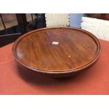 A mahogany circular Lazy Suzanne. 47cm diameter