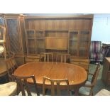 A Nathan teak dining table, six chairs and a wall unit