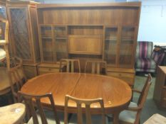 A Nathan teak dining table, six chairs and a wall unit