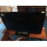 A Panasonic 40" television, with remote