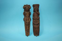 A pair of carved oak relief mouldings