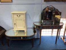 A cream bedside cabinet, a mirrored coffee table, side table and a triple mirror