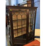 An Edwardian mahogany china cabinet, on cabriole legs