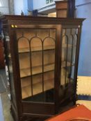 An Edwardian mahogany china cabinet, on cabriole legs