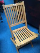 A set of four teak folding garden chairs (as new)