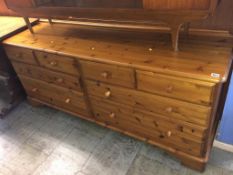 A long pine chest of drawers