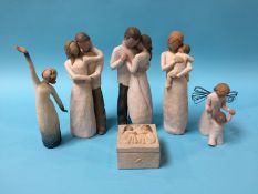 Five willow tree figures and a box