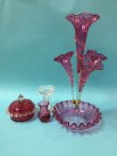 A Victorian cranberry four trumpet epergne and three pieces of glassware, 51cm height