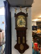 A walnut cased double weight wall clock