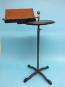 A Victorian mahogany reading stand, on cast iron base.