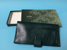 A boxed leather Rolex wallet