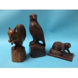 Two carved wood animals, signed B. Quinn and a carved wood bird of prey (3)