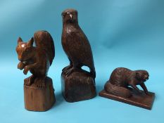 Two carved wood animals, signed B. Quinn and a carved wood bird of prey (3)