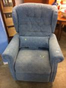 A blue electric recliner armchair