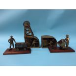 A collection of brass mining sculptures