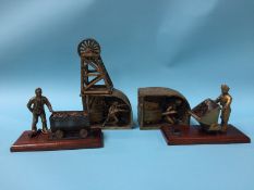 A collection of brass mining sculptures