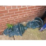 A pair of metalwork wall troughs