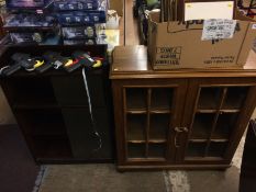 An oak china cabinet and a sliding door bookcase