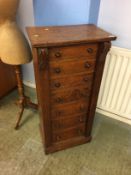 A 19th century narrow oak Wellington chest, with seven drawers, 49cm wide, 107cm high