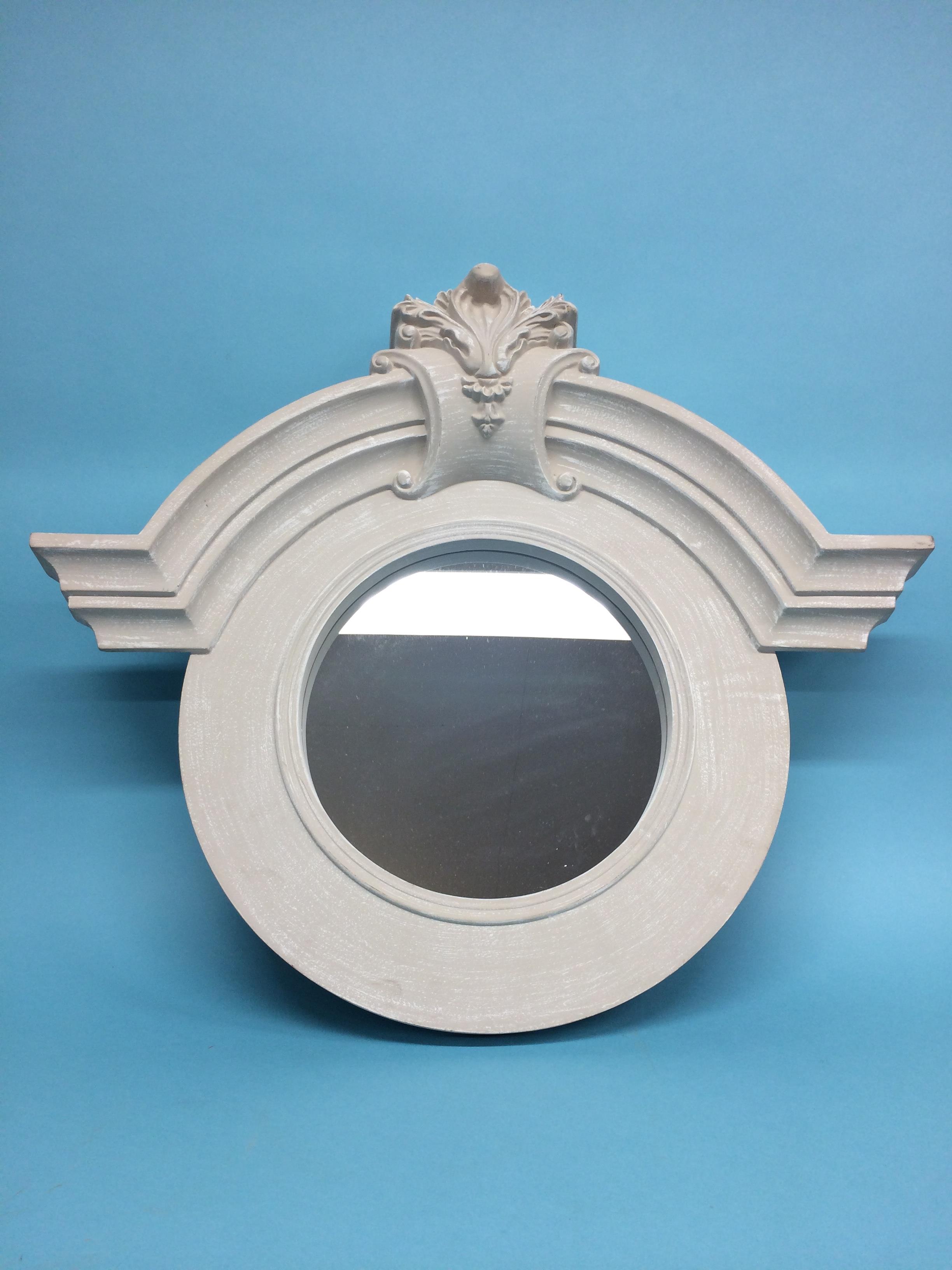 Circular mirror, in painted frame