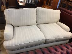 A Laura Ashley beige and striped two seater settee