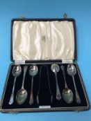 A cased set of silver spoons and sugar nips
