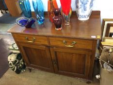 An Edwardian mahogany side cabinet