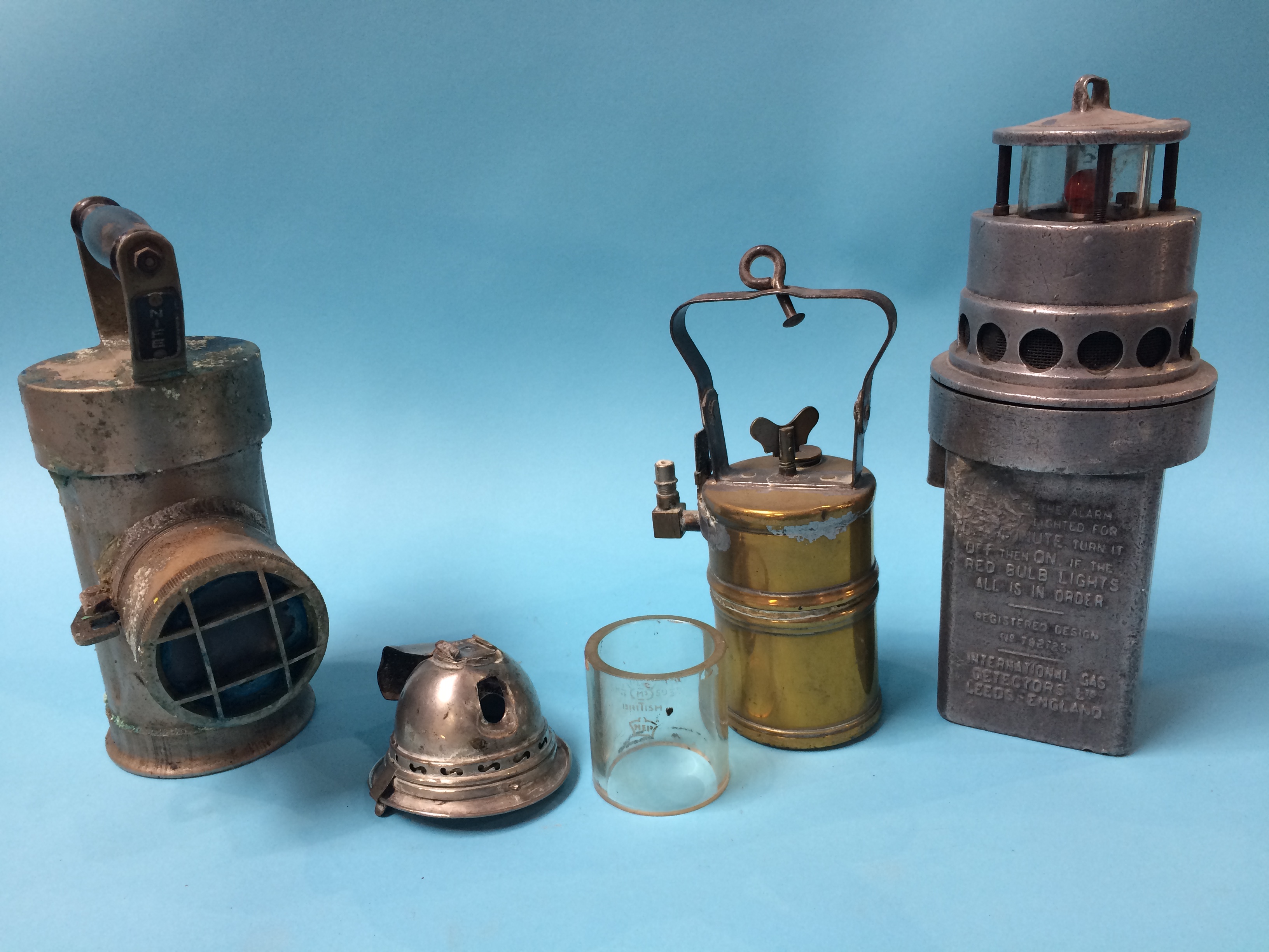 A 'Ringrose' lamp, an NG7 lamp and a small brass lamp