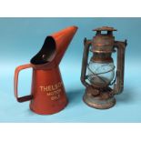 A 'Thelson Motor Oils' oil can and a lamp