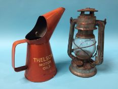 A 'Thelson Motor Oils' oil can and a lamp