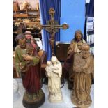 Five carved religious figures and a crucifix