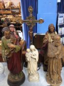 Five carved religious figures and a crucifix