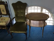 An Elbow chair and a mahogany occasional table