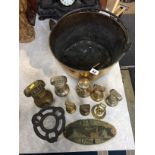 A brass jam pan and various brass weights