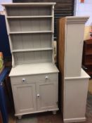 A small grey painted dresser and a kitchen shelf unit