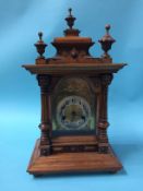 An Edwardian walnut cased 8 day mantel clock