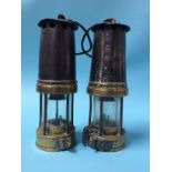 Two unmarked Miner's lamps