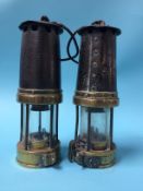 Two unmarked Miner's lamps